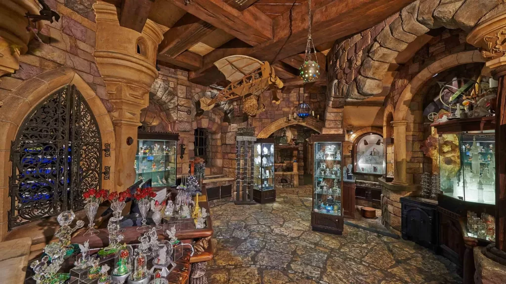 Disneyland Paris Merlin l'Enchanteur showcases enchanting souvenirs and mystical treasures inspired by the legendary wizard Merlin.